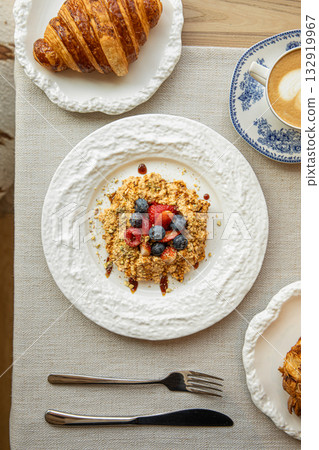 Oatmeal with berries and honey for breakfast 132919967