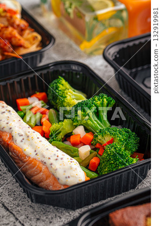 Salmon with vegetables in meal prep box 132919981