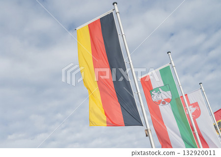 The German flag flutters against the sky in Dortmund 132920011