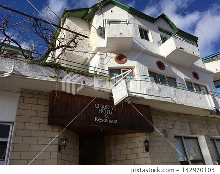 Cyprus, Pedoulas - December 31 2016 - Exterior of Christys Hotel in Cyprus mountain village of Pedoulas. Tradition, travel, and quiet charm of small Mediterranean hospitality. Cyprus, Pedoulas - December 31 2016 - Exterior of Christys Hotel in Cyprus mountain village of Pedoulas. Tradition, travel, and quiet charm of small Mediterranean hospitality. 132920103