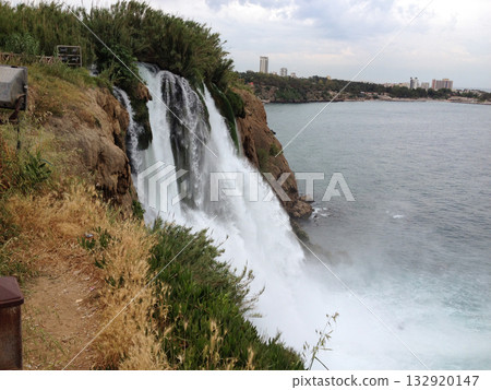 Duden Waterfall crashes down rocky cliff near city in Turkey in the province of Antalya . Force, motion, gravity, solitude, erosion, time, connection, awe, freedom, and escape from urban routine 132920147
