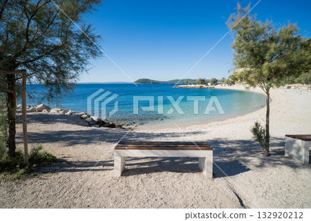 a beautiful beach with a view of the Adriatic Sea with rocks on the shore and pine trees in Split, Croatia a beautiful beach with a view of the Adriatic Sea with rocks on the shore and pine trees in Split, Croatia 132920212