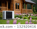 Heat pump in front of log cabin 132920416