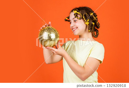 holiday celebration. Little beautiful girl ready for party. time to relax. small girl want to dance. childhood happiness. retro disco party. Young pin-up girl with curlers and disco ball 132920918