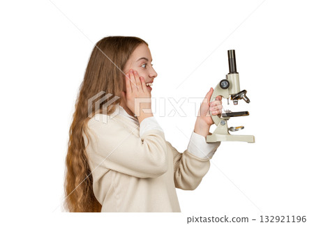 Biology science for surprised schoolgirl. Microscope research. Scientific education. School biology girl hold microscope. Student of biology. Back to school. Teen girl with microscope isolated white Biology science for surprised schoolgirl. Microscope research. Scientific education. School biology girl hold microscope. Student of biology. Back to school. Teen girl with microscope isolated white 132921196