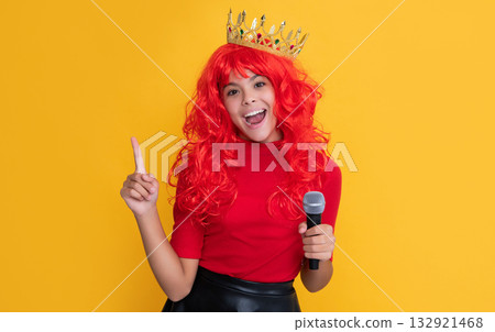 inspired with idea kid in crown with microphone on yellow background inspired with idea kid in crown with microphone on yellow background 132921468