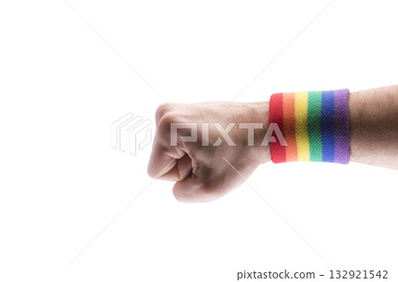 Hand fist with colorful rainbow LGBT wristband isolated on white background with clipping path. Hand fist with colorful rainbow LGBT wristband isolated on white background with clipping path. 132921542