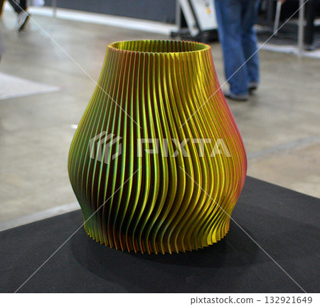Object printed on 3D printer close up. Model printed on 3D printer from molten plastic. Vase printed on 3D printer from molten plastic. 3D printing technology. Additive progressive FDM technologies Object printed on 3D printer close up. Model printed on 3D printer from molten plastic. Vase printed on 3D printer from molten plastic. 3D printing technology. Additive progressive FDM technologies 132921649