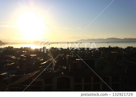 Sunrise and Lake Titicaca in Puno, Peru, South America Sunrise and Lake Titicaca in Puno, Peru, South America 132921729