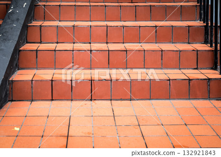 Terracotta Tiled Stairs with clean lines and geometric structure, representing architecture, texture Terracotta Tiled Stairs with clean lines and geometric structure, representing architecture, texture 132921843