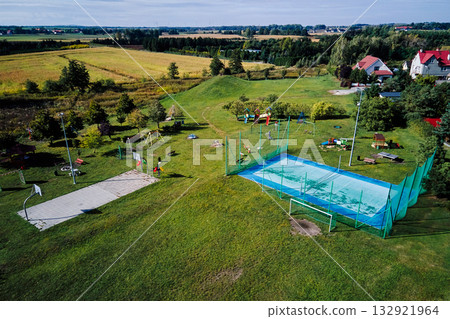 Aerial view of outdoor playground and sports field in suburban area 132921964