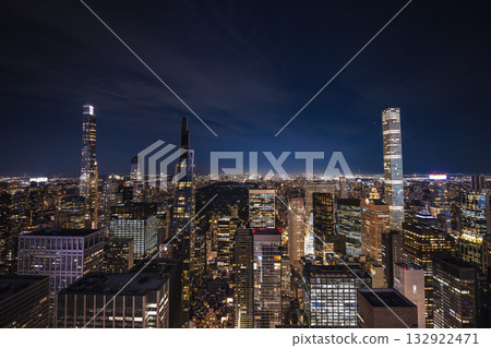 Night panoramic view of Midtown Manhattan with illuminated skyscrapers and Central Park in the distance 132922471