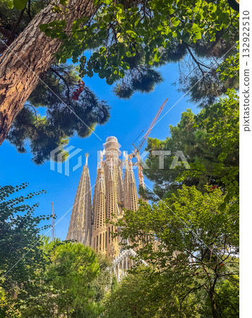 City Street View with La Sagrada de Familia Cathedral Towers and Residential Architecture 132922510