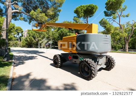 Self-Propelled Boom Lift on Park Pathway Self-Propelled Boom Lift on Park Pathway 132922577