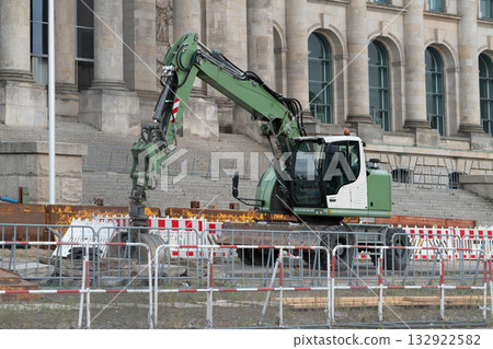 Wheeled Hydraulic Excavator at Urban Construction Site Wheeled Hydraulic Excavator at Urban Construction Site 132922582
