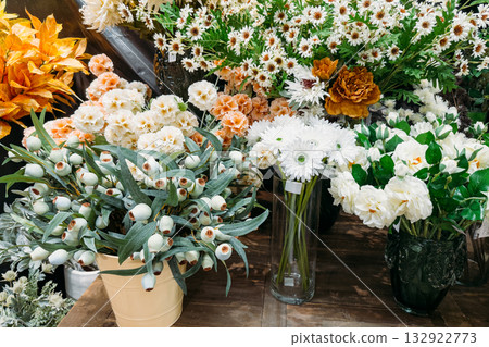 Assorted white and pastel faux florals in mixed textures including daisies, carnations, and lotus pods. Artificial florals, reusable bouquets, sustainable decor, floral styling for events Assorted white and pastel faux florals in mixed textures including daisies, carnations, and lotus pods. Artificial florals, reusable bouquets, sustainable decor, floral styling for events 132922773