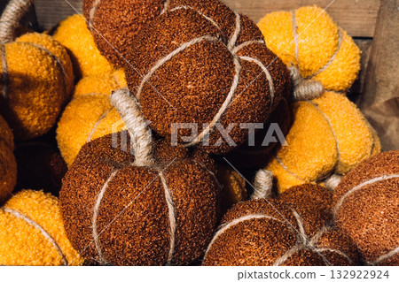 Brown and yellow textured fabric pumpkins with twine stems. Handmade fall decor, cozy textures, yarn art, seasonal crafting inspiration Brown and yellow textured fabric pumpkins with twine stems. Handmade fall decor, cozy textures, yarn art, seasonal crafting inspiration 132922924