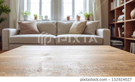 Cozy living room with a wooden coffee table and a comfortable sofa 132924027