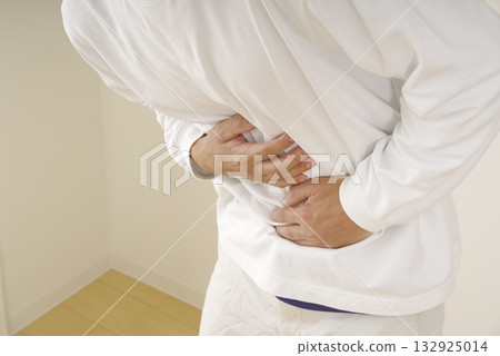 Middle-aged man suffering from stomach pain Middle-aged man suffering from stomach pain 132925014