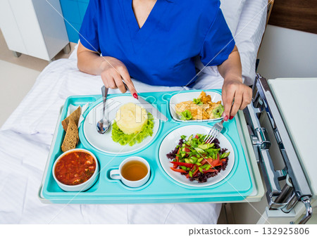 Tray with breakfast for the young female patient. Tray with breakfast for the young female patient. 132925806