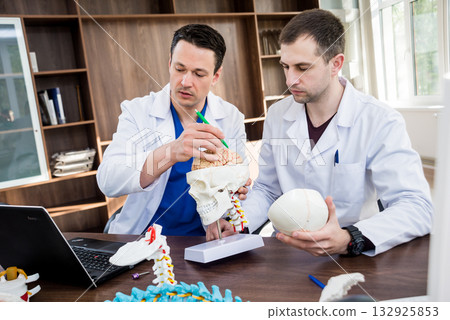 Two doctors having medical council in hospital. Two doctors having medical council in hospital. 132925853