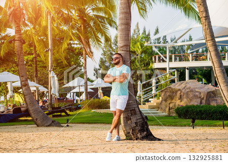 Young man on a tropical beach. Summer Young man on a tropical beach. Summer 132925881