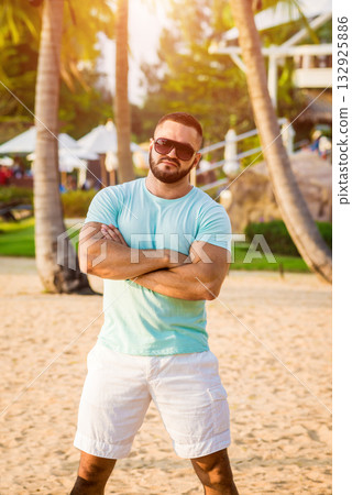 Young man on a tropical beach. Summer 132925886