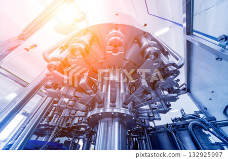 Bottling line of sunflower oil in bottles. Vegetable oil production plant. Bottling line of sunflower oil in bottles. Vegetable oil production plant. 132925997