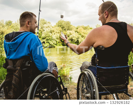 Handicapped men fishing at a lake. Wheelchair. Camping. Handicapped men fishing at a lake. Wheelchair. Camping. 132926182