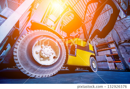 Forklift loader in storage warehouse ship yard. Distribution products.  132926376