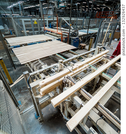 Production line of the wooden floor factory. CNC automatic woodworking machine. 132926437