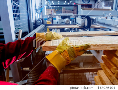 Carpenter with fibreboards at furniture factory workshop. Woodworking industry 132926504