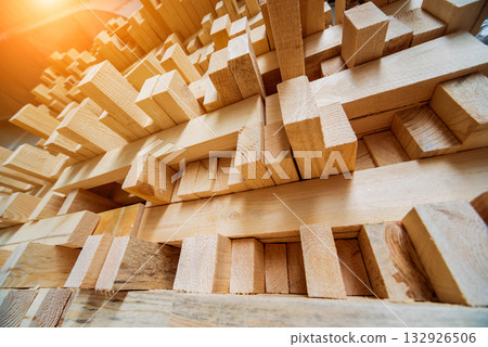 Stack of natural rough wooden boards. Wooden boards, lumber, industrial wood. Stack of natural rough wooden boards. Wooden boards, lumber, industrial wood. 132926506