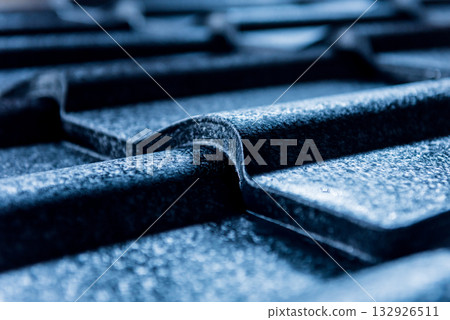 Blue metallic roof tiles background with drops of water. 132926511