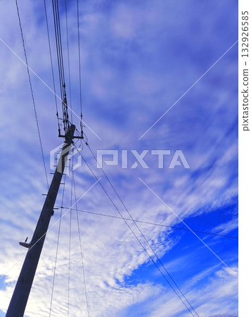 Autumn scale clouds on a telephone pole Autumn scale clouds on a telephone pole 132926585