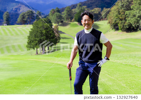 A middle-aged Japanese man enjoying golf A middle-aged Japanese man enjoying golf 132927640