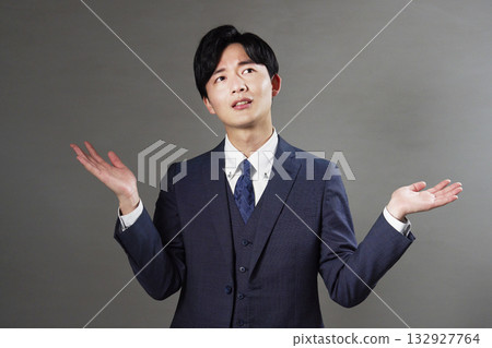 Businessman giving up black background Businessman giving up black background 132927764