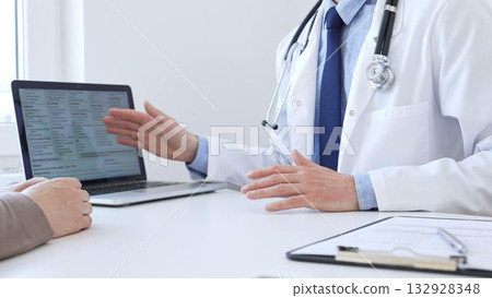 Close-up of a doctor reviewing digital test results with patient, discussing health findings on laptop screen during clinical consultation. Medicine and health care concept Close-up of a doctor reviewing digital test results with patient, discussing health findings on laptop screen during clinical consultation. Medicine and health care concept 132928348