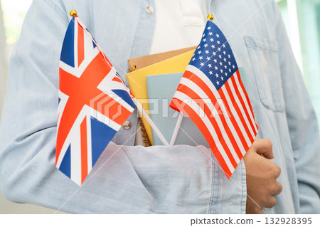 Learn English language, Asian teenage student hold book with flag in course at school. Learn English language, Asian teenage student hold book with flag in course at school. 132928395