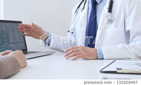 Close-up of a doctor reviewing digital test results with patient, discussing health findings on laptop screen during clinical consultation. Medicine and health care concept Close-up of a doctor reviewing digital test results with patient, discussing health findings on laptop screen during clinical consultation. Medicine and health care concept 132928407