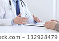 Adult doctor gesturing with hands while explaining diagnosis to patient during medical consultation in hospital office, healthcare and medical concept. Medicine concept 132928479