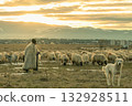 Shepherd with flock of sheep and guard dog at sunset rural scene 132928511