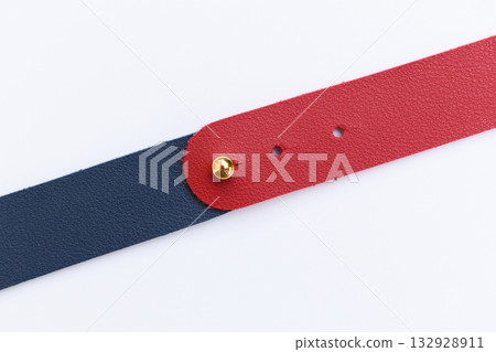 dark blue and red leather strap isolated on white background 132928911