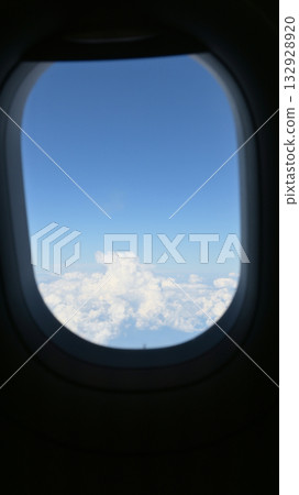Scenery outside the window of a passenger plane, beautiful blue sky and white cloud view Scenery outside the window of a passenger plane, beautiful blue sky and white cloud view 132928920