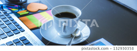 Banner Top view office desk laptop and coffee cup on wood table copy space.  Panorama tabletop notebook laptop coffee cup for officer display empty space wooden background workspace full banner design 132930358