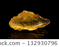 Golden yellow barite on dark background 132930796