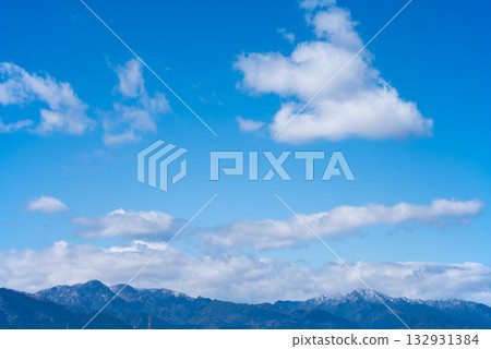 Winter blue sky and mountain range Winter blue sky and mountain range 132931384