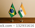 Brazilian and Indian flags lined up on a desk 132931616