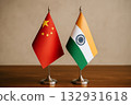 Chinese and Indian flags lined up on a desk 132931618