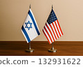 Israeli and American flags lined up on a desk 132931622